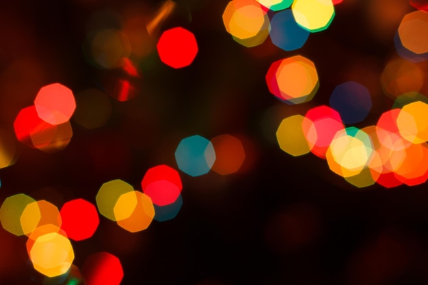 Blurred background with colorful festive lights Holiday night paty Abstract circular bokeh