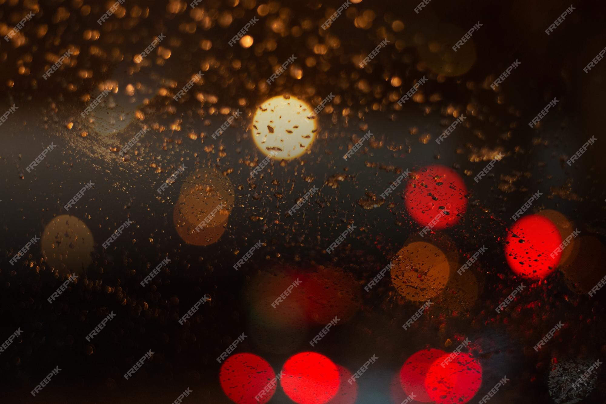 Premium Photo | Blurred background with raindrops and lights