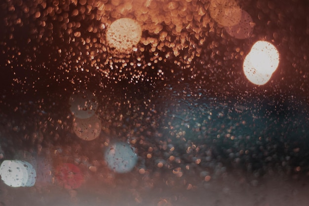 Blurred background with raindrops and lights