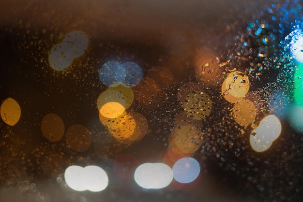 Blurred background with raindrops and lights