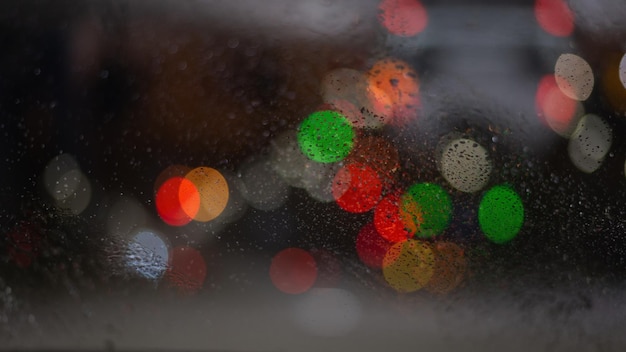 Blurred background with raindrops and lights