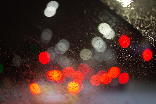 Blurred background with raindrops and lights.