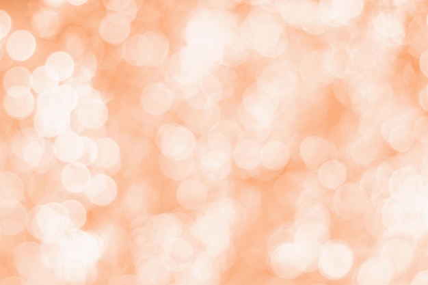 Photo blurred bokeh background trending color of the year 2024 peach fuzz