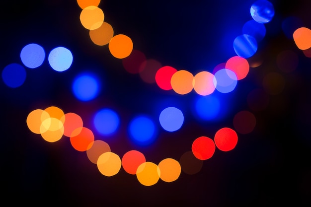 Blurred bokeh blue green orange with large spots