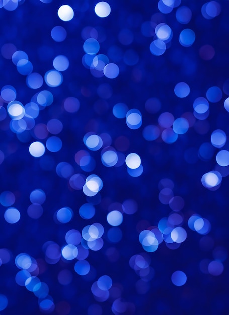 Blurred bokeh light on dark blue background Christmas and New Year holidays template