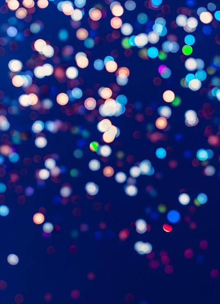 Photo blurred bokeh light on dark blue background christmas and new year holidays template