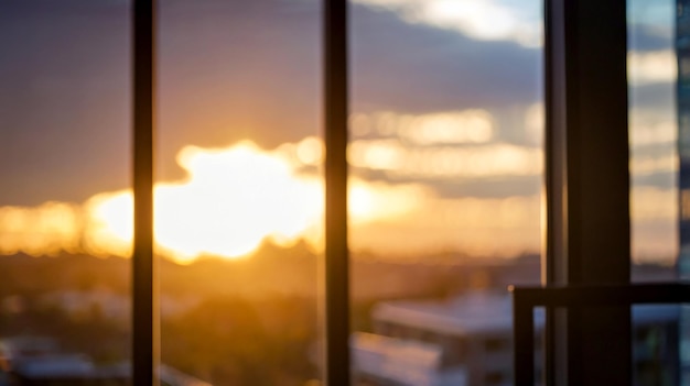 blurred bokeh of a sunrise breaking through the window of a tech startup office