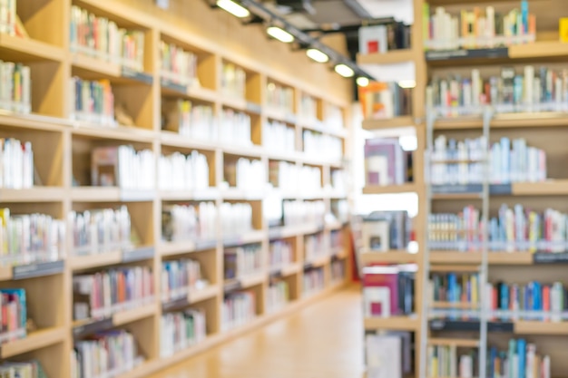 blurred bookshelf in library room for your background design