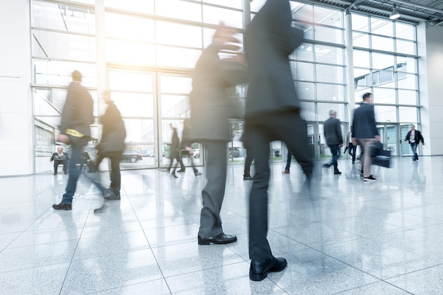 Blurred business people at a Exhibition in a modern hall