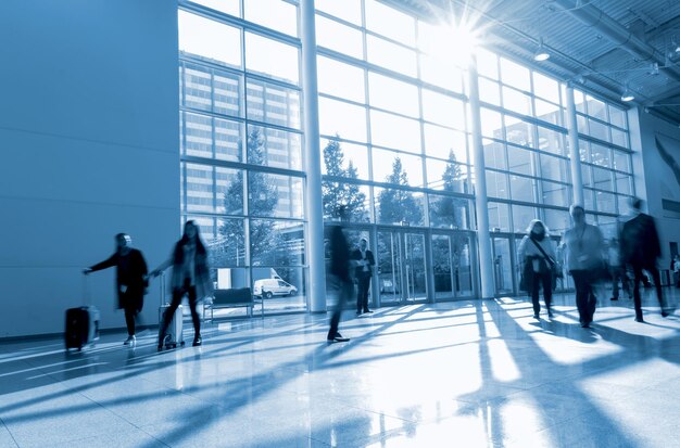 Blurred business people at a modern hall