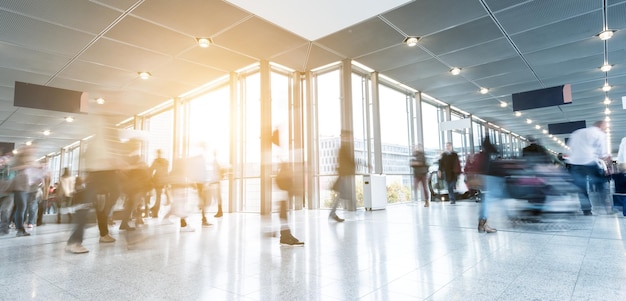 Blurred business people rushing at a corridor