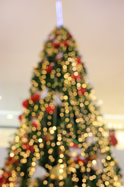 Blurred colorful bokeh lights on Christmas tree background.