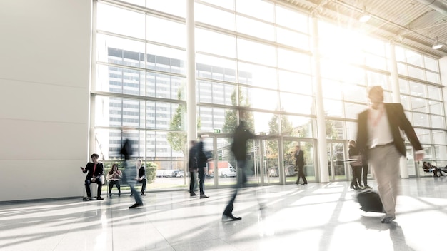 blurred commuters walking at a Exhibition