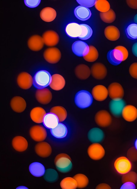 blurred defocused bright light lens flare shiny spots dark background