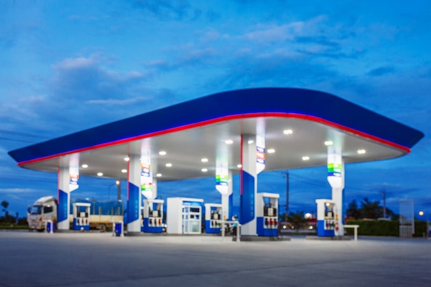 Photo blurred of gas station in blue night sky