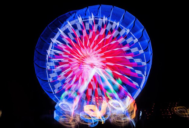 Blurred giant wheel ferris at night