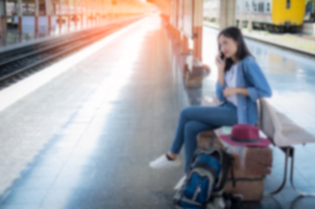 Premium Photo | Blurred girl waiting for train in railway station