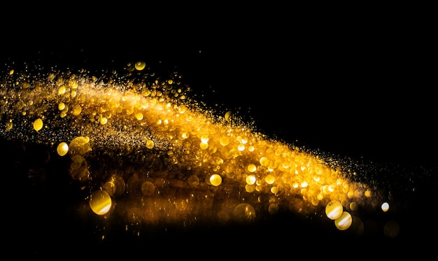 Blurred glitter bombs, gold glitter defocused abstract Twinkly Lights grunge Background.