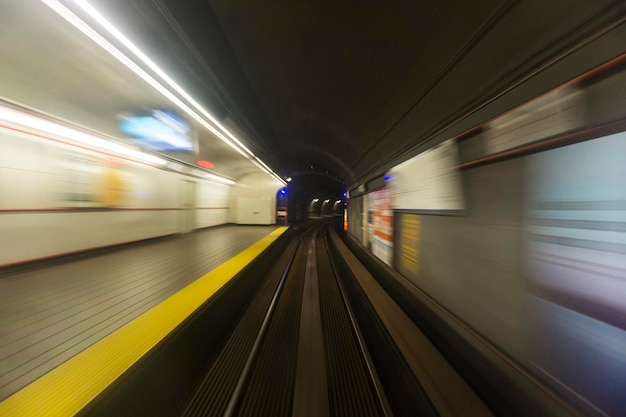 Blurred high speed motion of a train travelling through a tunnel