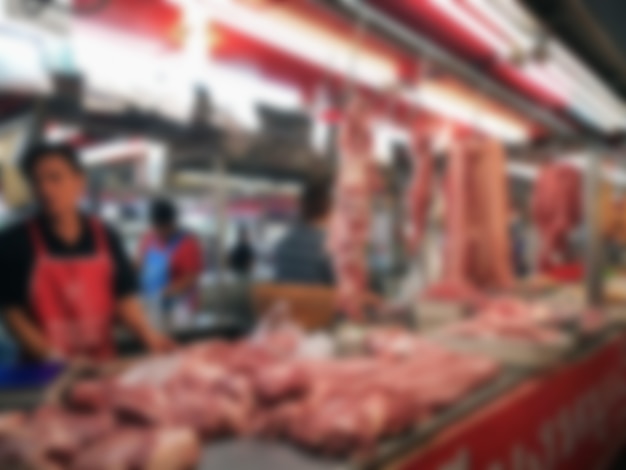 Photo blurred image of meat shop in street market for background