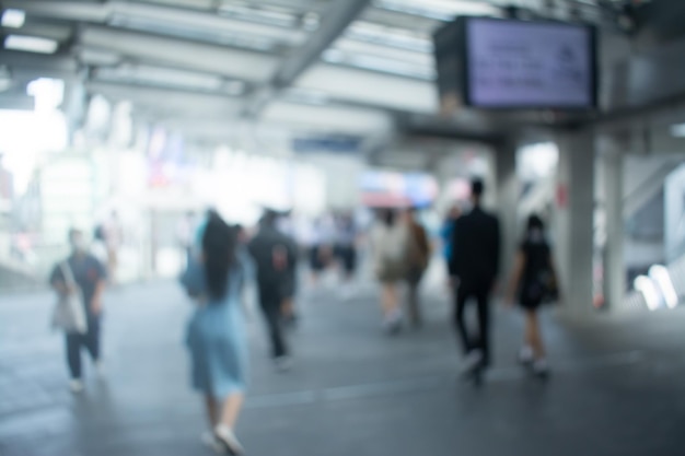 Blurred image of people walking at walkway