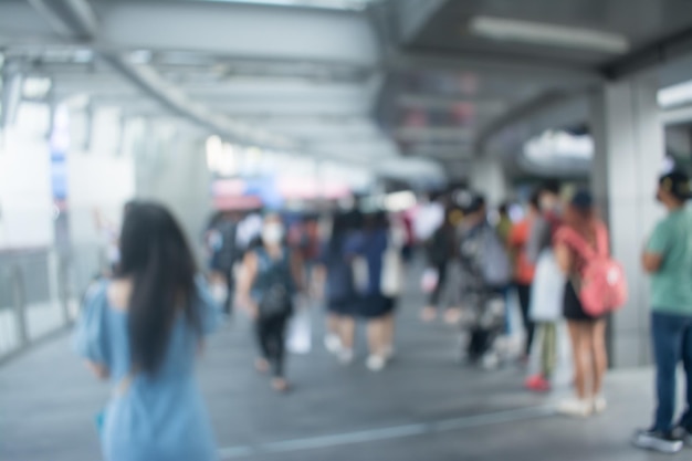 Blurred image of people walking at walkway