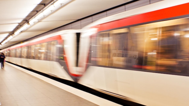 Blurred image of train moving at subway station