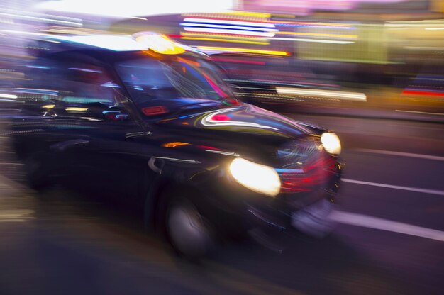 Blurred motion of car on road at night