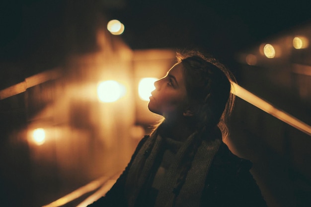 Blurred motion of illuminated people at night