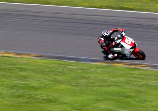 Blurred motion of man on motorcycle