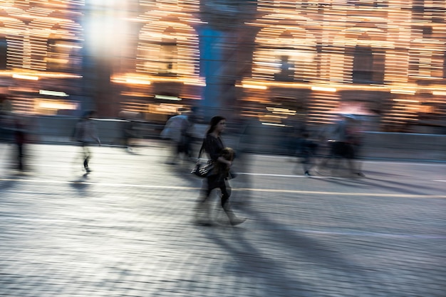 Blurred motion of people in city