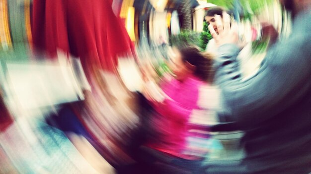 Blurred motion of people in park