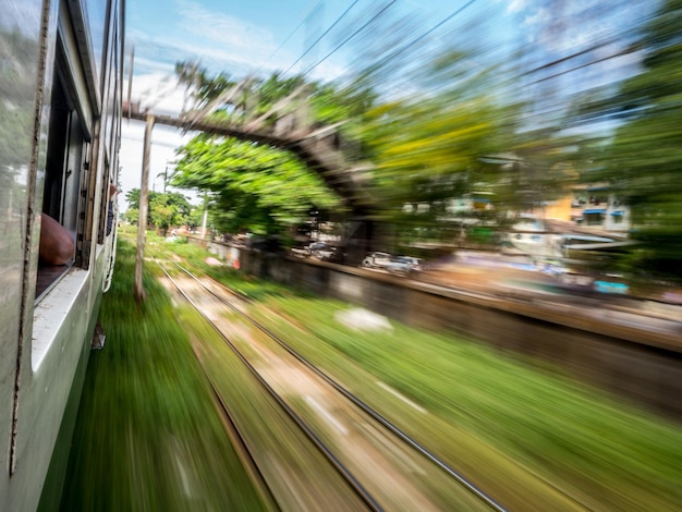 Photo blurred motion of train on railroad track