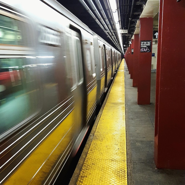 Blurred motion of train at subway station