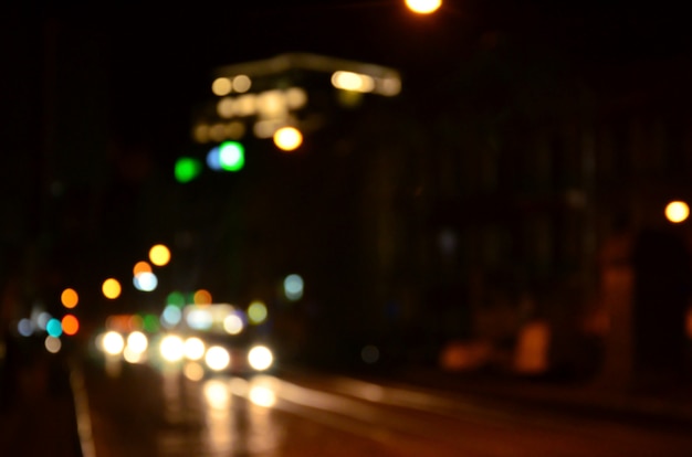 Blurred night scene of traffic on the roadway.