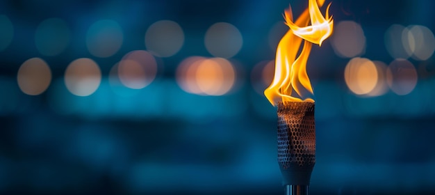 Размытый огонь олимпийского факела, горящий на спортивной арене с пространством для текста