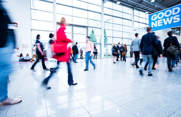 Blurred people at a trade fair