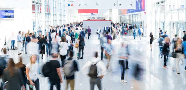 Blurred people at a trade fair