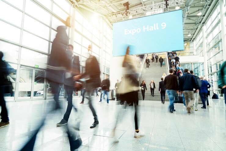 Blurred people at a trade fair