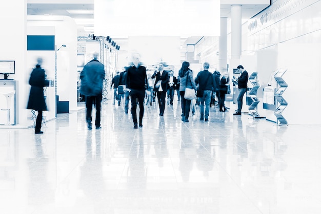 Blurred people at a trade fair