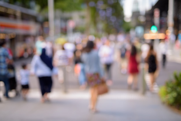 Blurred People Walking In Singapore City At Orchard Road In Horizontal Shot