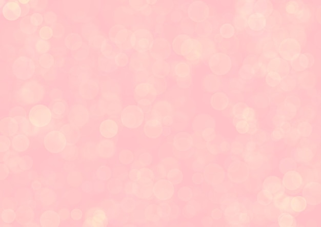 Blurred pink background with golden circle sparkling lights. Shiny pastel red glittery bokeh of christmas garland.