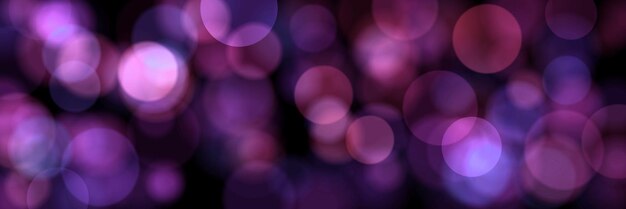 Blurred pink particles on black long background