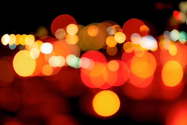 Blurred red and orange bokeh background Blur abstract background of urban light Warm light