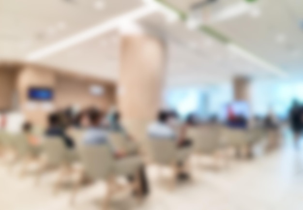 Blurred scene of crowded people queuing waiting for vaccinations in hospital