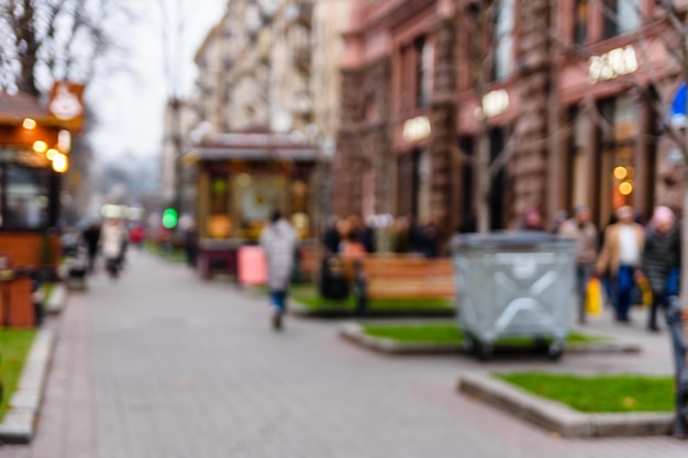 Blurred silhouettes of different people in a crowded street