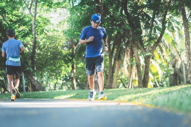 Blurred soft images of an Asian man are exercise by jogging for health in the park