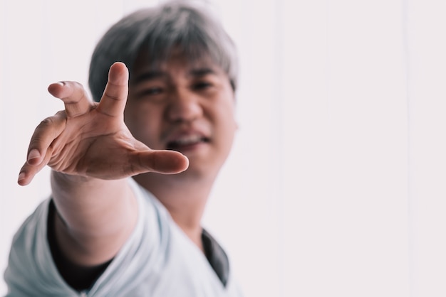 Blurred soft images of A man stretching out his hand For help