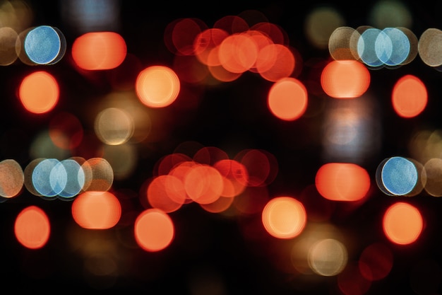 Photo blurred street lights, urban abstract background.