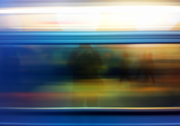 Blurred train in motion with reflection of a man background